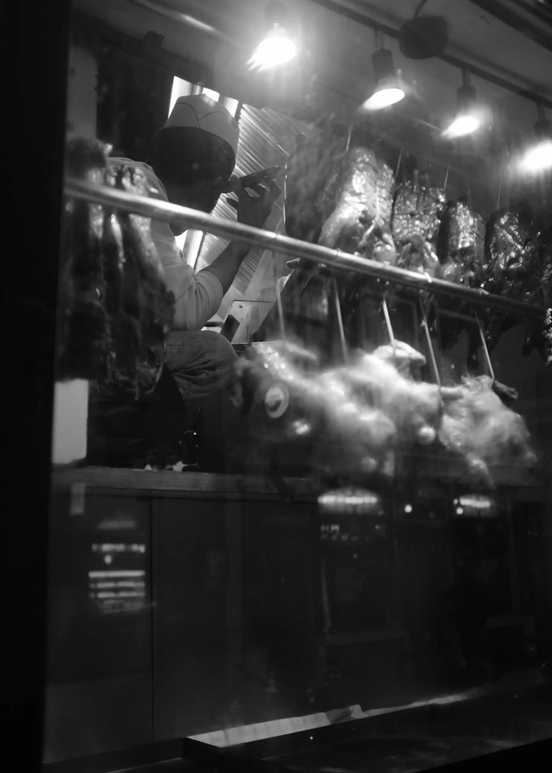 A lit shop window at night